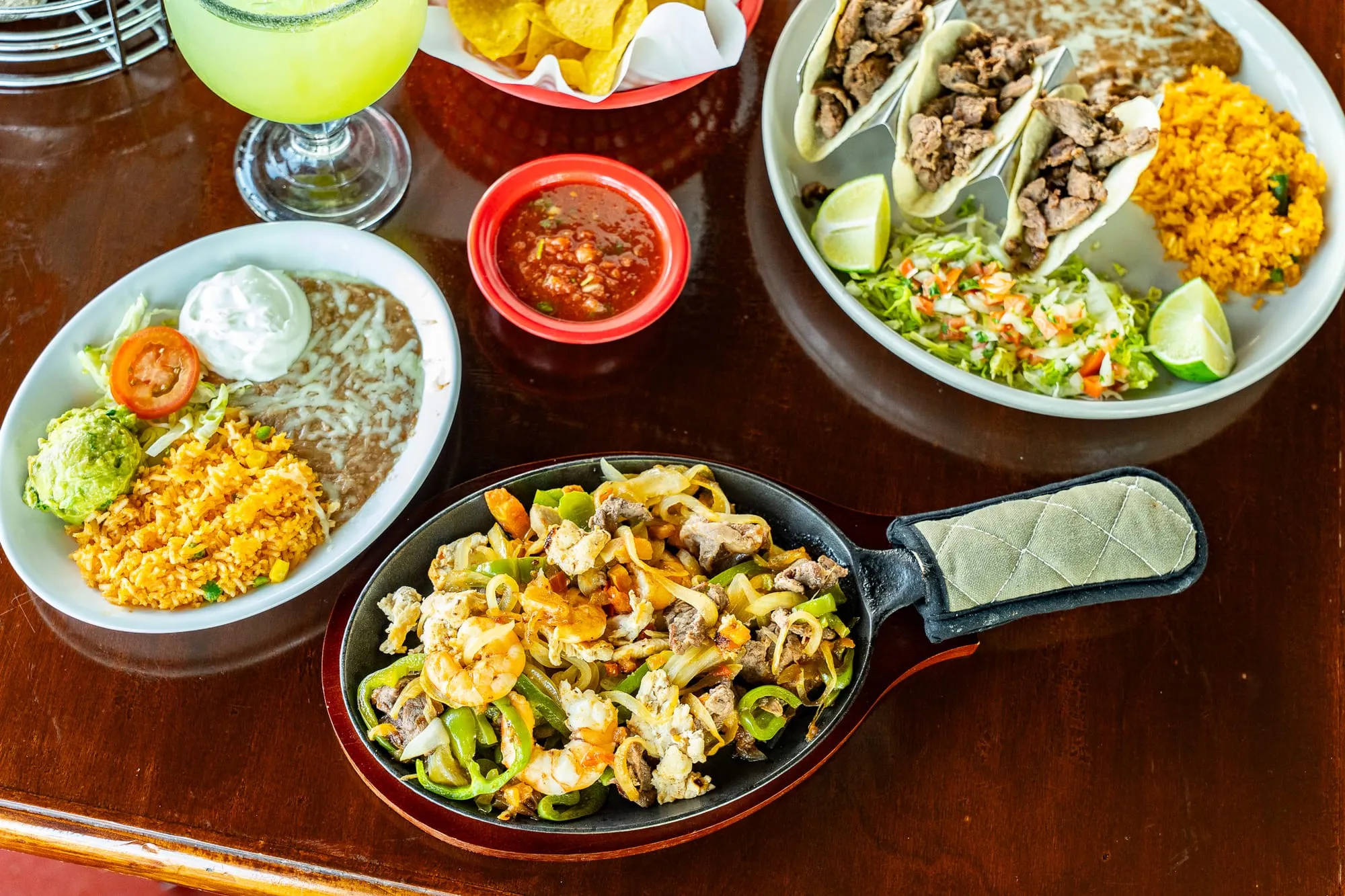A Cozumel combination plate with rice, refried beans, and authentic Mexican entrées